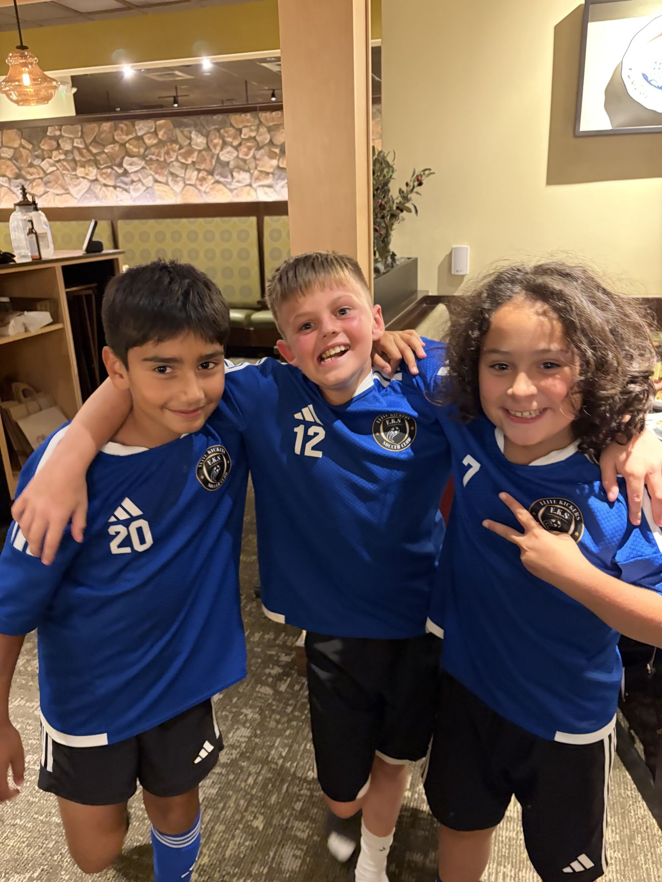 Three EKS U11 teammates together