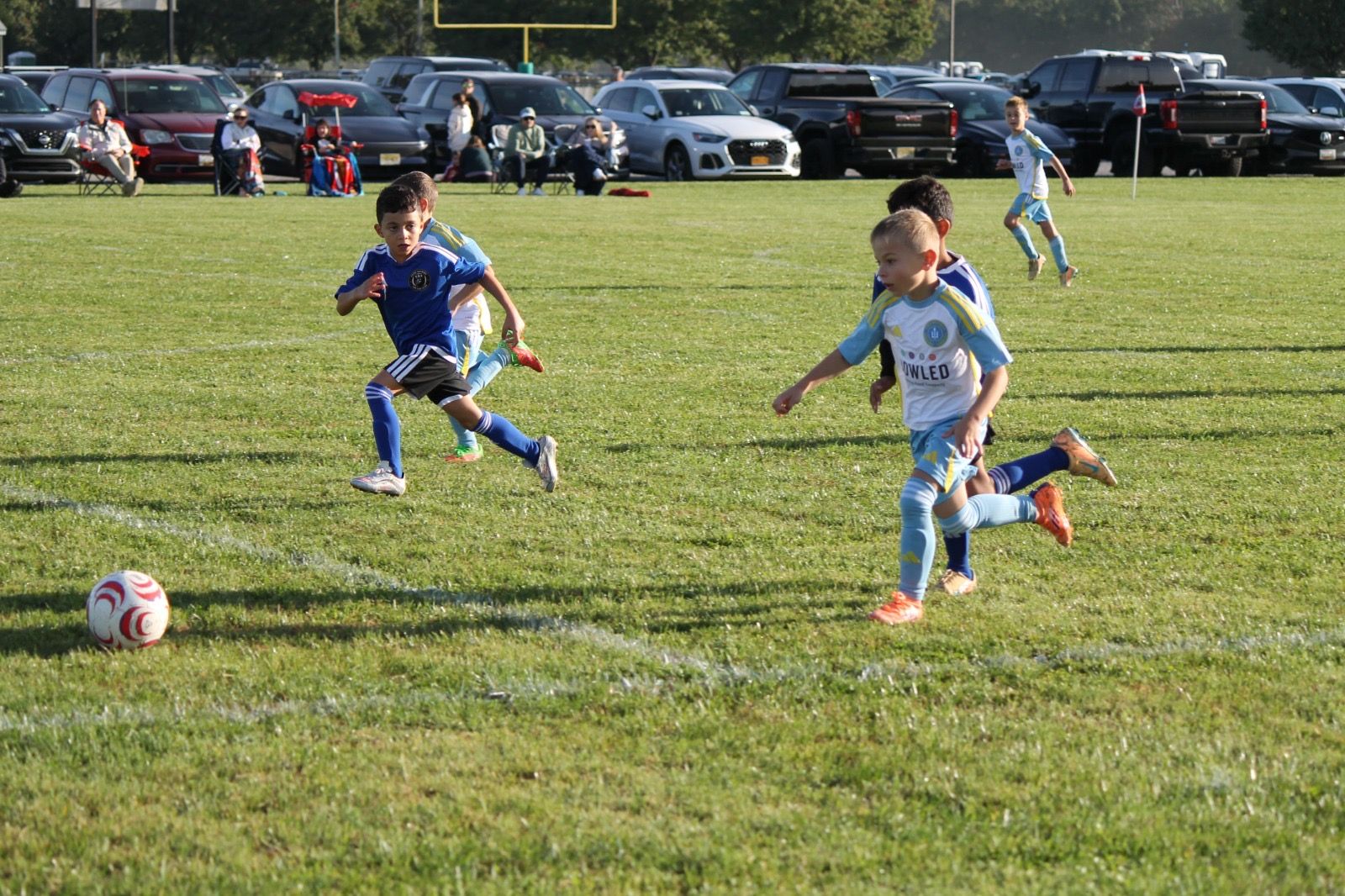 EKS U8 player chasing the ball